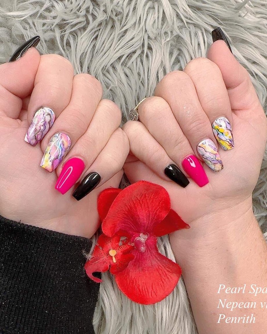 Custom hand-painted nail art by Pearl Spa